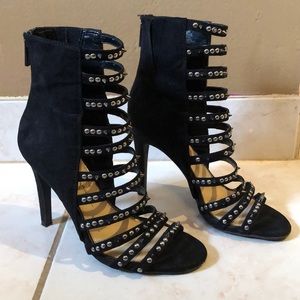 Black suede heels with silver embellishment
